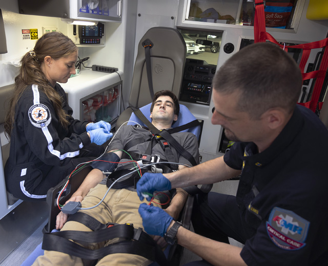 EMS workers and patient in EMS vehicle